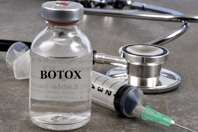 bottle of botox with syringe
